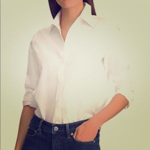White buttondown Lauren shirt, 3/4 length sleeves.